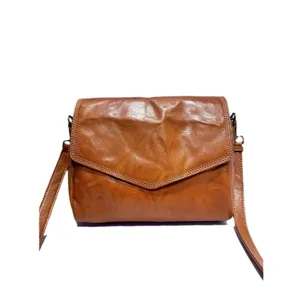 Vintage brown leather crossbody bag for women, stylish envelope shoulder bag with flap design.