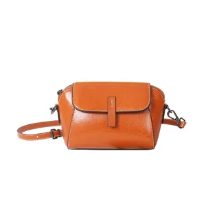 Vintage oil wax leather crossbody bag for women, elegant retro shell shoulder bag design.