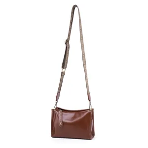 Genuine leather vintage crossbody bag for women, brown casual shoulder bag with wide strap.