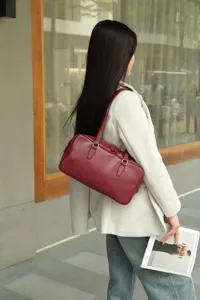 Vintage genuine leather underarm shoulder bag for women, stylish retro baguette handbag.