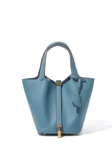 Classic genuine leather bucket handbag with top handles and stylish gold lock closure.