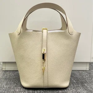 Sac seau en cuir premium avec fermeture a cadenas, grand sac a main minimalist pour femmes.