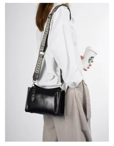Women's black genuine leather shoulder bag with wide vintage patterned strap crossbody purse.