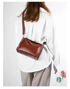 Vintage vegetable-tanned genuine leather messenger bag, stylish brown pillow crossbody bag.