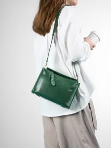 Classic green genuine leather crossbody bag for women, retro pillow shoulder bag design.