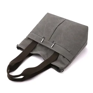 Grey canvas tote bag for women, stylish large capacity shoulder handbag for daily use.