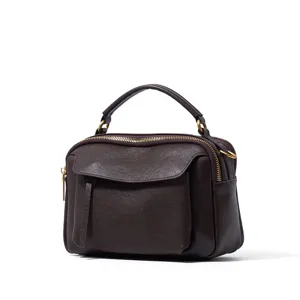 Dark brown genuine leather Boston handbag for women, vintage top-handle crossbody bag detail.