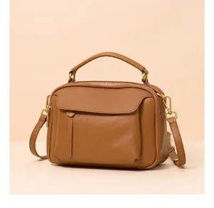Detailed view of retro leather handbag, showing exquisite craftsmanship and metal hardware.
