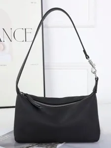 Black genuine leather underarm shoulder bag for women, casual minimalist hobo pillow handbag.