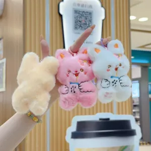 Cute plush bunny keychain pendant with boba tea design, soft stuffed animal bag charm.