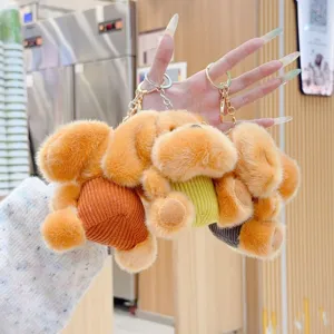 Cute fluffy striped puppy plush keychain detail, soft stuffed animal bag charm pendant accessory.