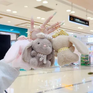 Cute fluffy bunny keychain plush toy bag charm with plaid scarf and bow decoration.