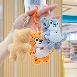 Cute embroidered animal plush keychain bag charm, soft stuffed toy pendant for keys and backpacks.