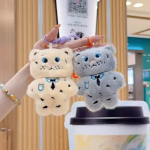 Cute plush animal keychain with embroidered shirt design, soft toy bag pendant accessory.
