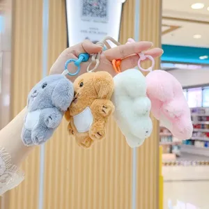 Vue detaillee porte-cleurs chien en peluche jouet animal en peluche mignon et colore.