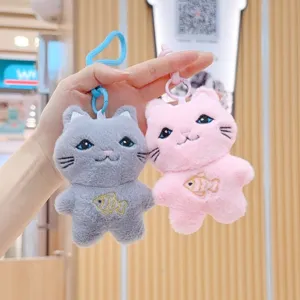 Detailed view of cute plush cat keychains with embroidered fish design, soft fabric and colorful straps.