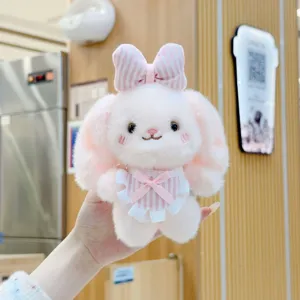Cute plush rabbit pendant keychain, sweet pink bow design, soft toy bag charm for women.