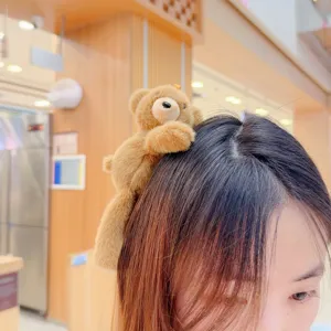 Cute plush teddy bear hair clip for women, soft furry cartoon animal bangs pin accessory.