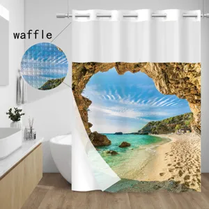 Close-up detail of the waffle weave shower curtain showing fabric texture and scenic beach print.