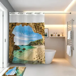 Ocean view shower curtain detail featuring scenic beach cave print and matching bathroom mat.