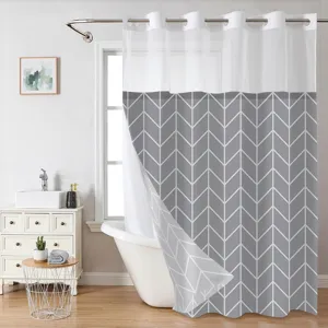 Detail view of double layer shower curtain, grey chevron pattern, sheer top, bathroom setup.