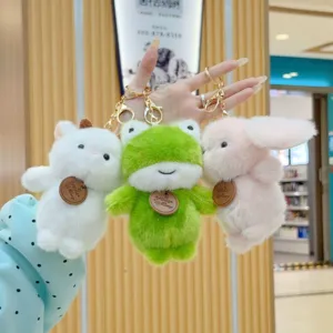 Cute plush animal keychain set featuring white cat, green frog and pink rabbit, soft toy pendant.
