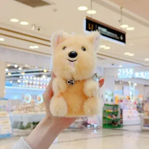 Close-up detail of the cute fluffy plush puppy toy featuring a tiny tongue and soft fur.