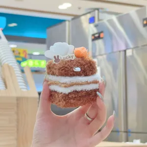 Cute fluffy cake plush pendant detail, soft chocolate pastry bag charm with cute floral decor.