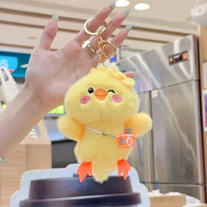Cute fluffy yellow duck plush keychain bag charm with mini camera pendant accessory.