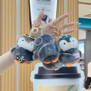 Cute plush penguin keychain with glasses and camera, soft stuffed doll bag pendant gift.