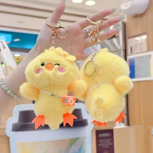 Cute yellow duck plush keychain bag pendant fluffy chick doll with camera detail view