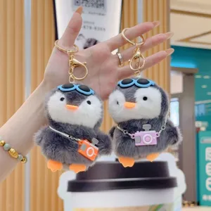 Cute chunky penguin plush keychain with mini camera and sunglasses, soft stuffed toy gift.
