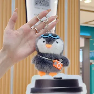 Cute penguin plush keychain with sunglasses and camera, soft toy bag charm pendant.