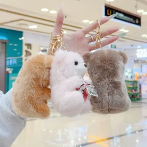 Cute plush bear keychain with bowknot, soft toy bag charm and key ring pendant for backpack.