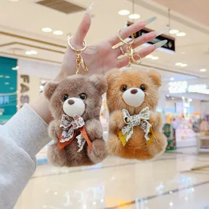 Cute plush bear keychain with lace bow, fluffy animal doll bag pendant, adorable toy gift.