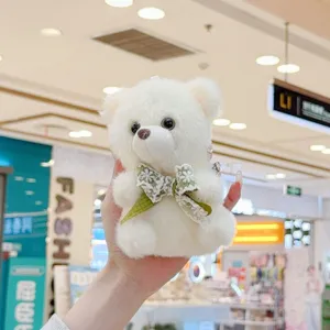 Cute white plush bear pendant with green lace bow, soft stuffed toy keychain for bags.