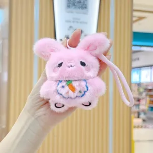 Cute pink plush bunny keychain detail shot, fluffy rabbit pendant with carrot embroidery.