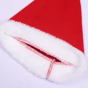 Close-up detail of a classic red and white Christmas Santa hat plush trim and stitching.