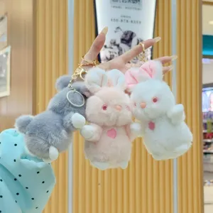 Cute plush rabbit keychains in grey, pink and white with heart embroidery for bags or keys.