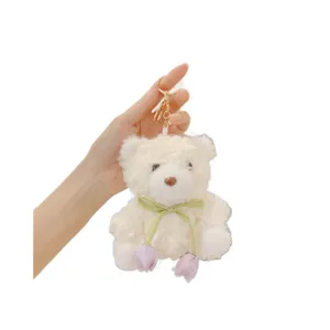 Cute plush bear keychain with flower ribbon, fluffy doll bag pendant for women and girls.