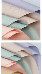 Waterproof floral wrapping paper detail view showing smooth texture and soft pastel colors.