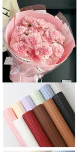 Embossed waterproof floral wrapping paper rolls shown in close-up bouquet styling shots.
