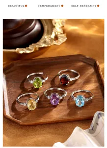 Detailed view of five S925 silver adjustable rings with colorful oval gemstones