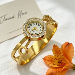 Elegante Damen-Armreif-Uhr in Gold mit Kristall-Lünette und ausgehöhltem Armband