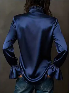 Back view of a premium navy blue satin blouse with elegant ruffle collar and flared cuffs