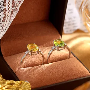 S925 sterling silver rings with oval peridot and citrine gemstones in jewelry box