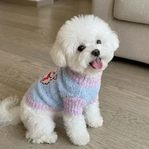 Detail shot of cute pet sweater featuring blue and pink color block fuzzy fabric with cute sheep.