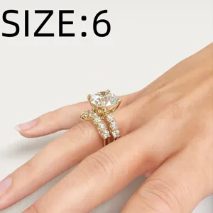 Gold four-prong solitaire round diamond ring set with micro-pave zircon detail view.