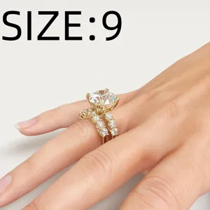 Detailed view of the gold four-prong round diamond stackable ring set with micro-pave zircon.