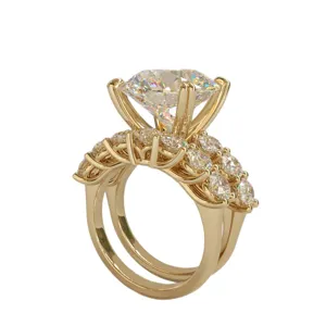 Gold double ring set featuring a large round diamond with micro-set zirconia details.